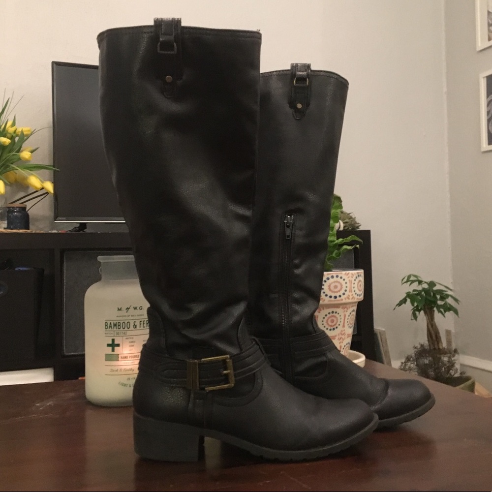 Black heeled knee high boots